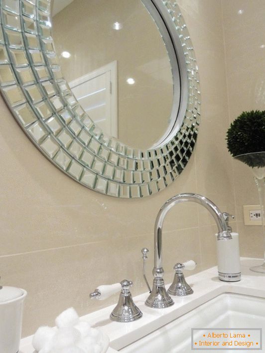 Stylish mirror over the sink in the bathroom