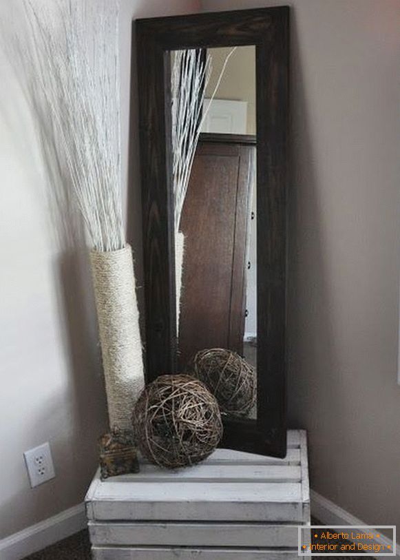 Old wooden box as a decoration element and a stand under the glass