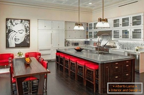 Kitchen with red accents and a portrait of Marilyn