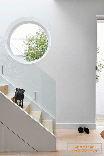Bright and light staircase with white decoration