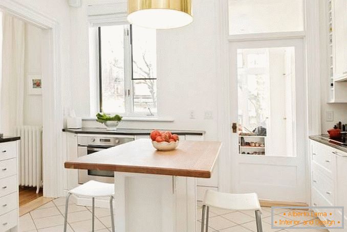 Stylish island in a small white kitchen