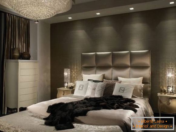 Classic chandelier and built-in lamps in the bedroom design