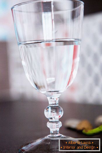 Glass with water on the bedside table