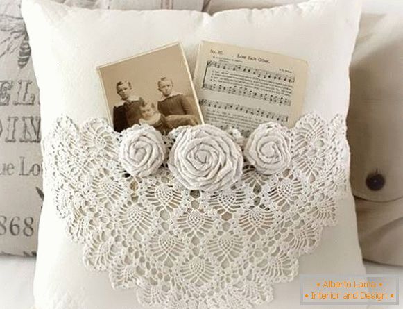 Openwork knitted cushions on the sofa, made by crochet