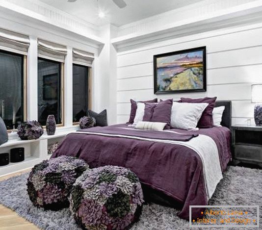 Black and white bedroom with violet accents