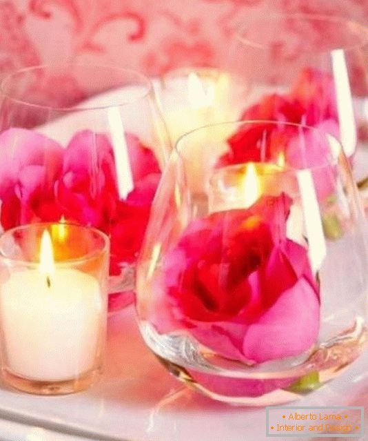 Flowers and candles as a table decoration for Valentine's Day