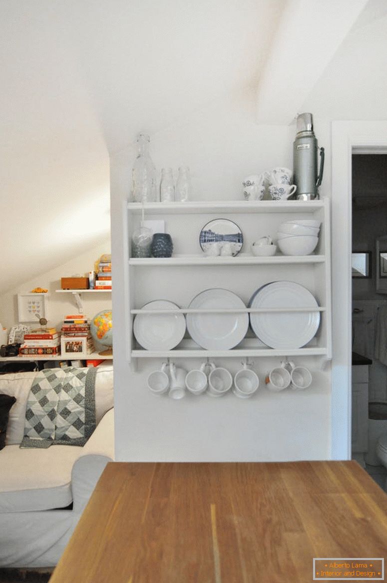 The idea of ​​storage for a small apartment. Vertical shelf for dishes in the apartment