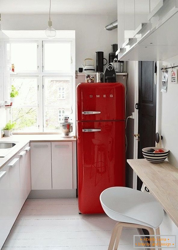 Bright refrigerator in white kitchen