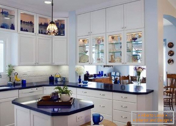 White kitchen - photo of corner kitchen in the interior with the island