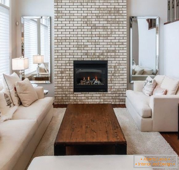 Stylish interior of the living room with white furniture and wood