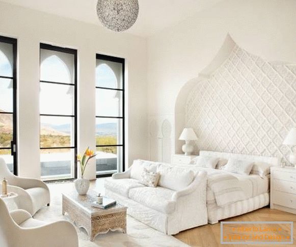Interior of white bedroom in Moroccan style