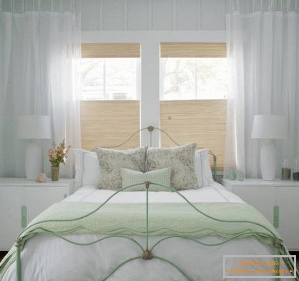 Village design of a white bedroom - photo with green accents