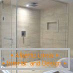 Shower cubicle with sand tile and white door
