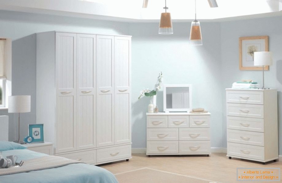White wardrobe, chest of drawers and cabinet in the bedroom