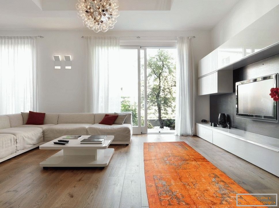 Orange carpet in combination with white furniture and walls