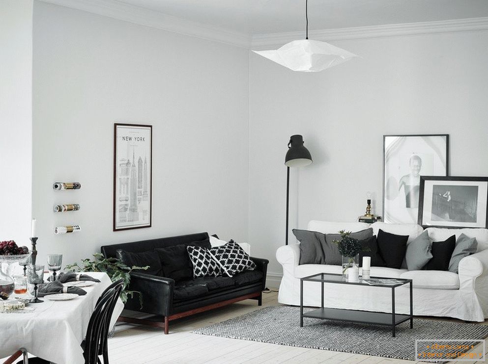 Living room is white with a black sofa