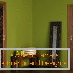 Light green walls and laminate wood