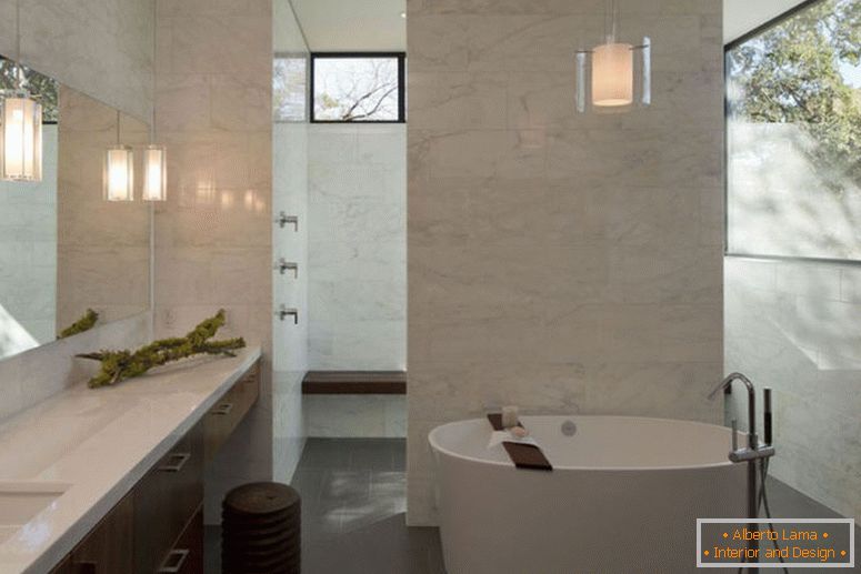 stylish-marble-bathroom-for-private-heaven-aura-with-bath-space-using-round-white-bathtub-pendant-lamp-above-also-near-mirror-as-washingstand-lamps