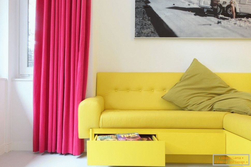 Yellow sofa and crimson curtains