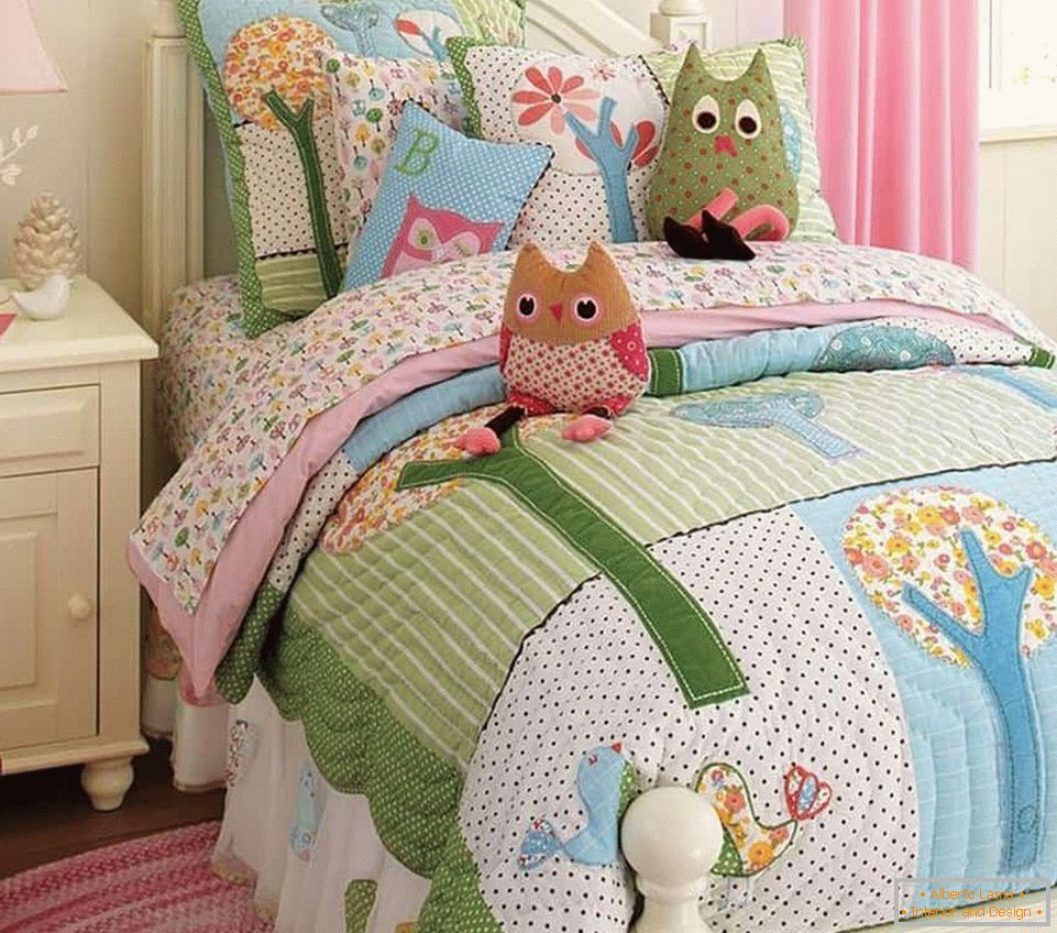 Bedspread and cushions in the nursery in the nursery