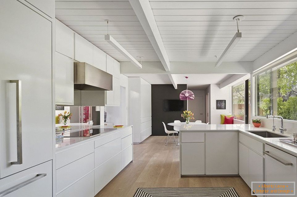 White kitchen decor with wooden ceiling