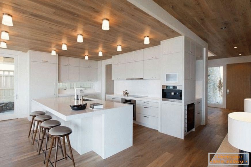 Spacious kitchen with wooden ceiling