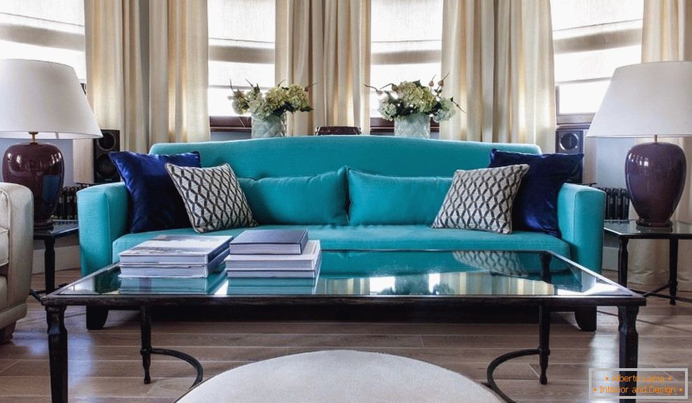 Turquoise sofa in a gray interior