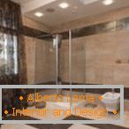 Shower room with brown tiles
