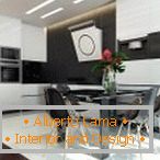 Black table and chairs in white kitchen