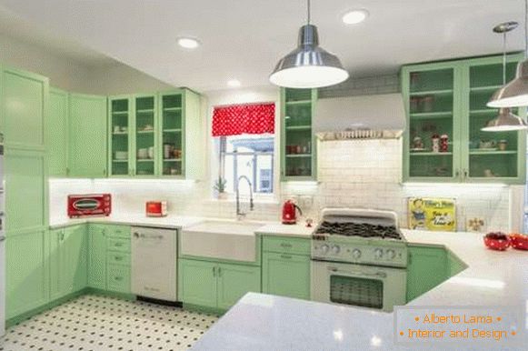 Green corner kitchen in a private house - modern design on the photo