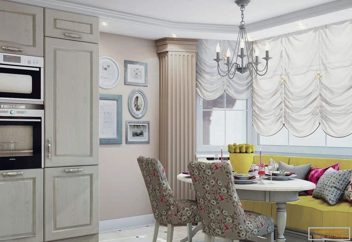 Location of a dining table and a soft diva in the kitchen with a bay window