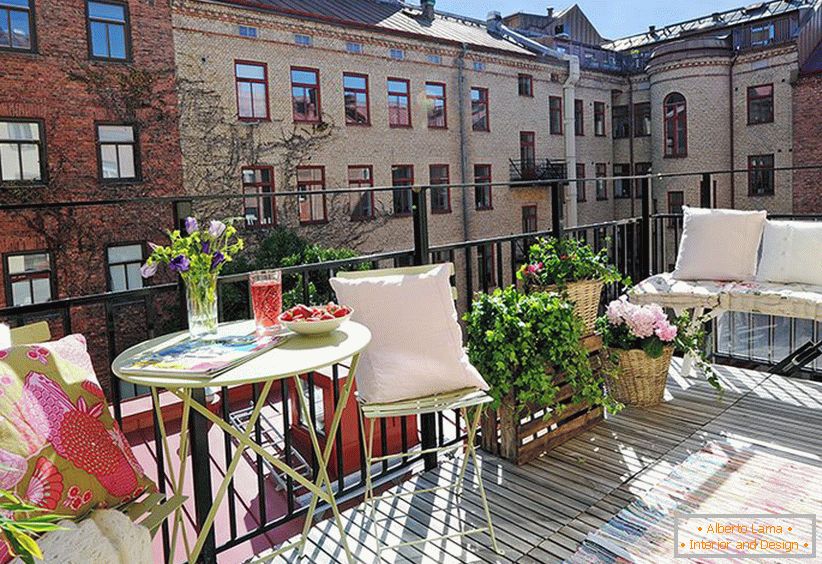 Pillows and plants on the balcony