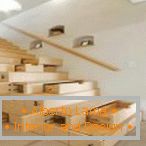 Retractable shelves under the stairs in the house