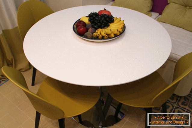 Curtains of bright cream color in the interior of the kitchen