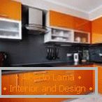 Flat black apron in the orange kitchen