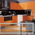 The combination of orange and gray in the kitchen