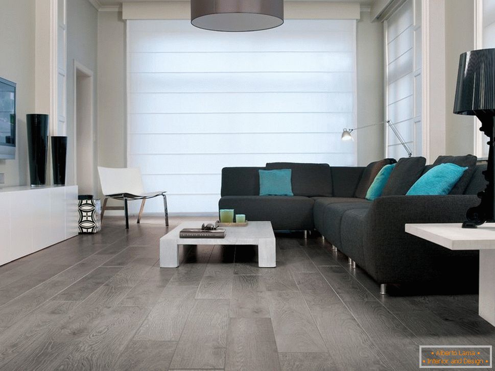 Gray color of the floor in the interior of the living room