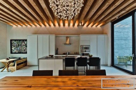 Wooden beams on the ceiling in the living room and kitchen