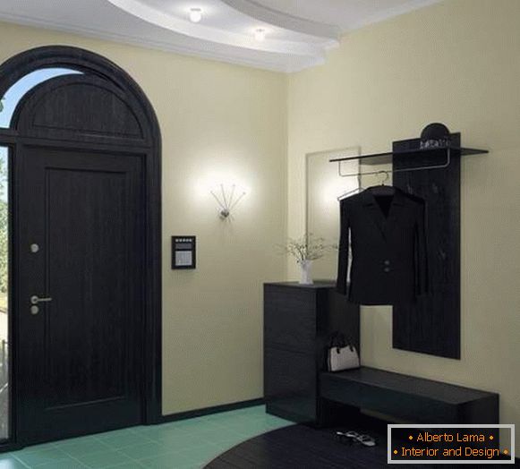 Black furniture in a modern hallway design in a private house