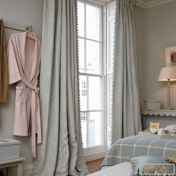 Gray curtains on the window from floor to ceiling