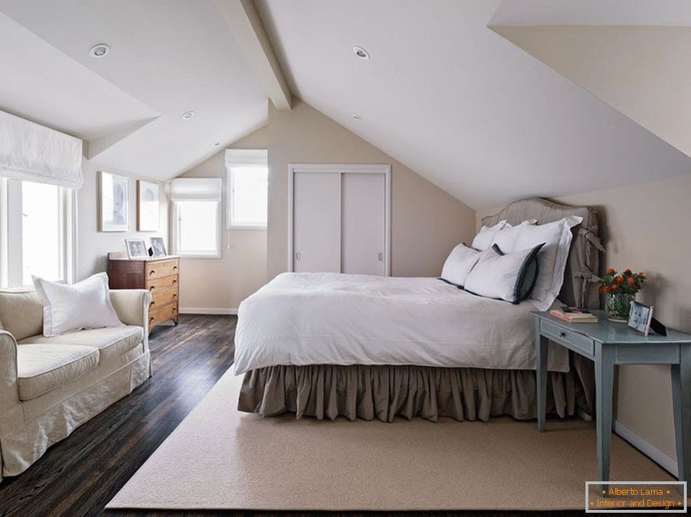 Bedroom in the attic with windows