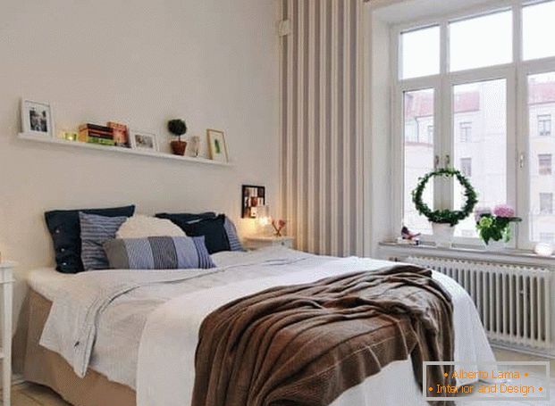 Light bedroom 4 by 4 meters with a large window