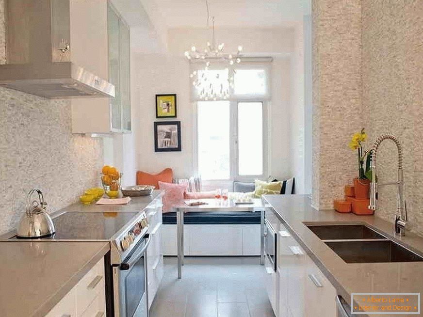 Narrow kitchen with dining area by the window