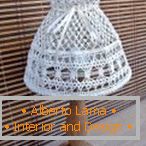 Lamp with an openwork shade