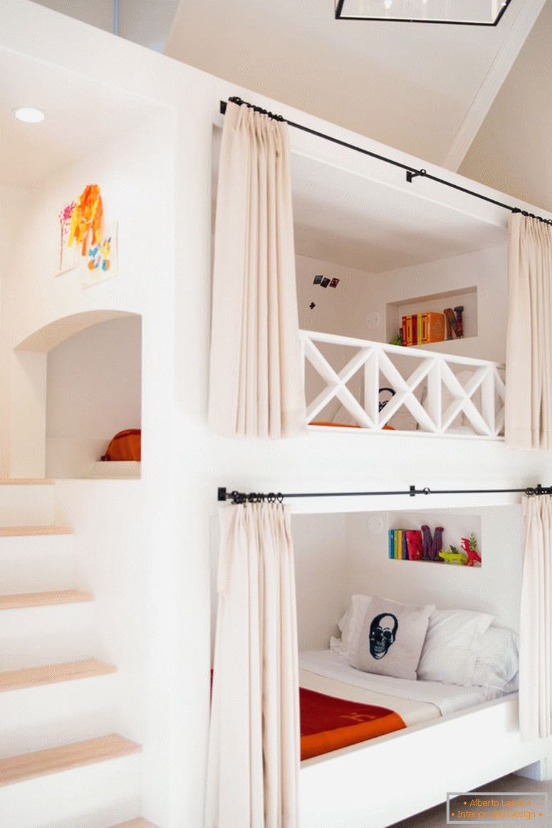 Bunk bed with curtains in the bedroom