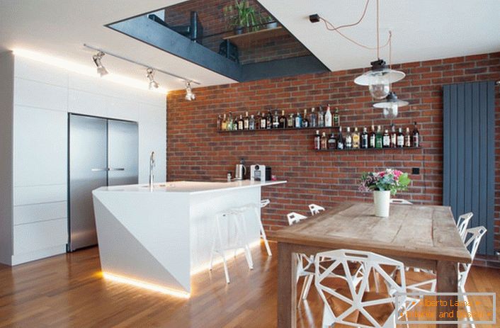 The kitchen is decorated in a modern loft style. Interesting furniture makes the interior bright, eccentric and memorable.