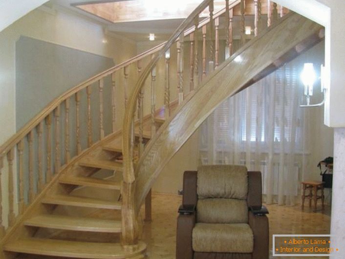 Elegant staircase with original design. The design of the staircase is made of noble light oak.