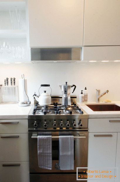 Steel gas cooker in white kitchen