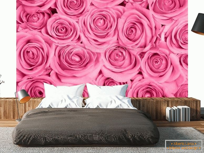 Bright roses on the wall in the bedroom
