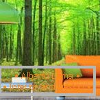 Orange sofa on a green forest background